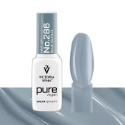 Lakier hybrydowy Victoria Vynn Pure Vegan Creamy Hybrid No.286 Blue Silence 8ml - butelka obok paznokietnika w odcieniu niebiesko szary
