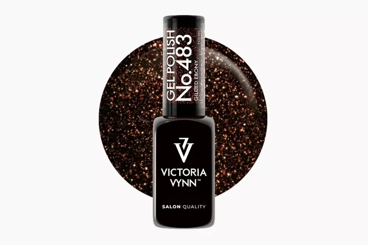 Victoria Vynn Gel Polish 483 Gilded Ebony 8 ml, butelka lakieru hybrydowego na tle ciemnobrązowego wybarwienia z miedzianym brokatem